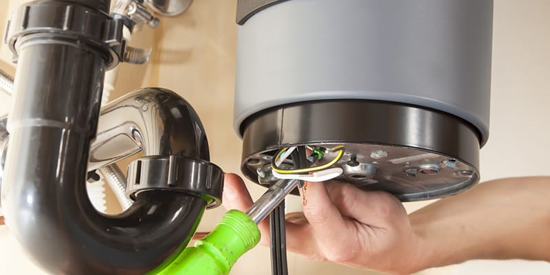 Technician repairing the heating element of a water heater in Valrico
