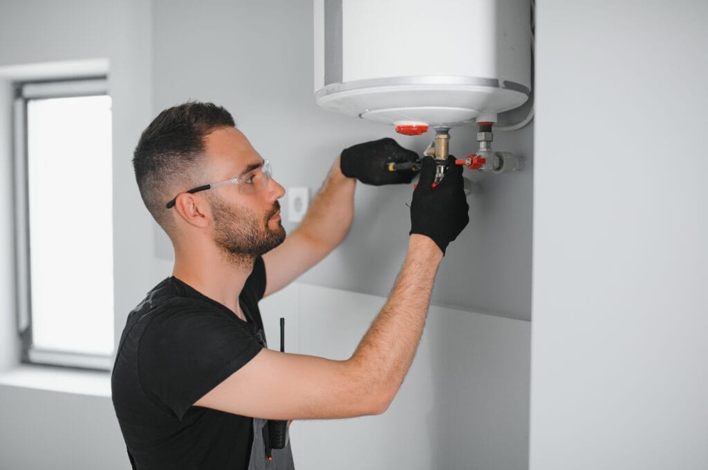Technician performing water heater maintenance in Valrico